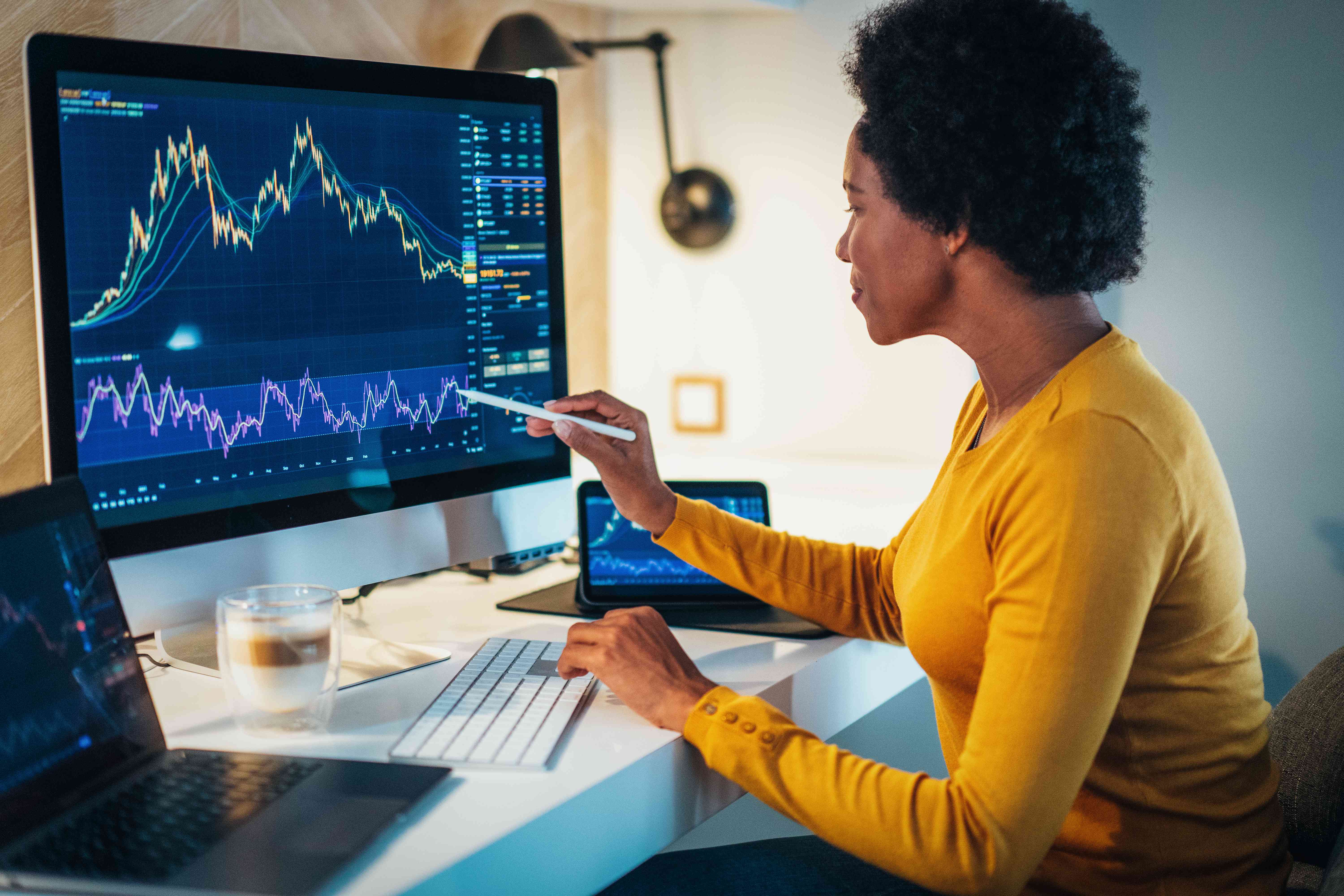 Woman looking at a chart on a monitor