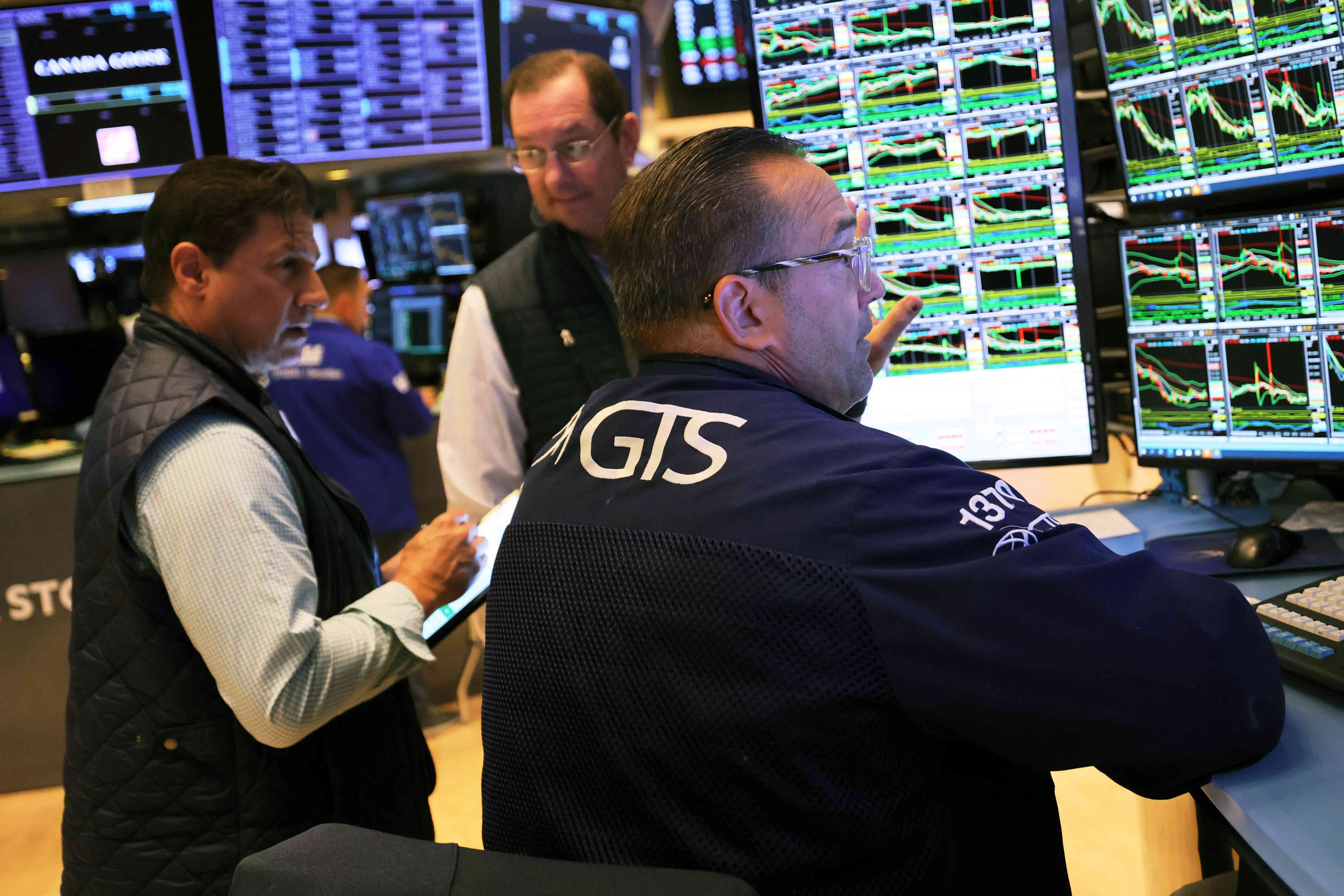 Traders work on the floor of the New York Stock Exchange