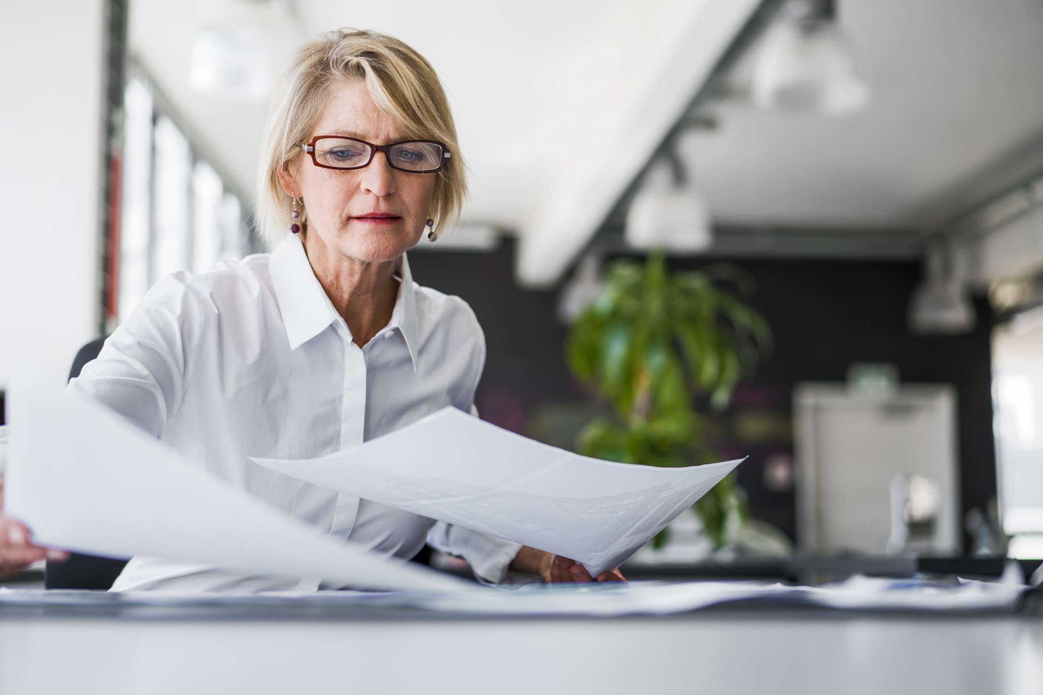 Person reviewing paperwork.