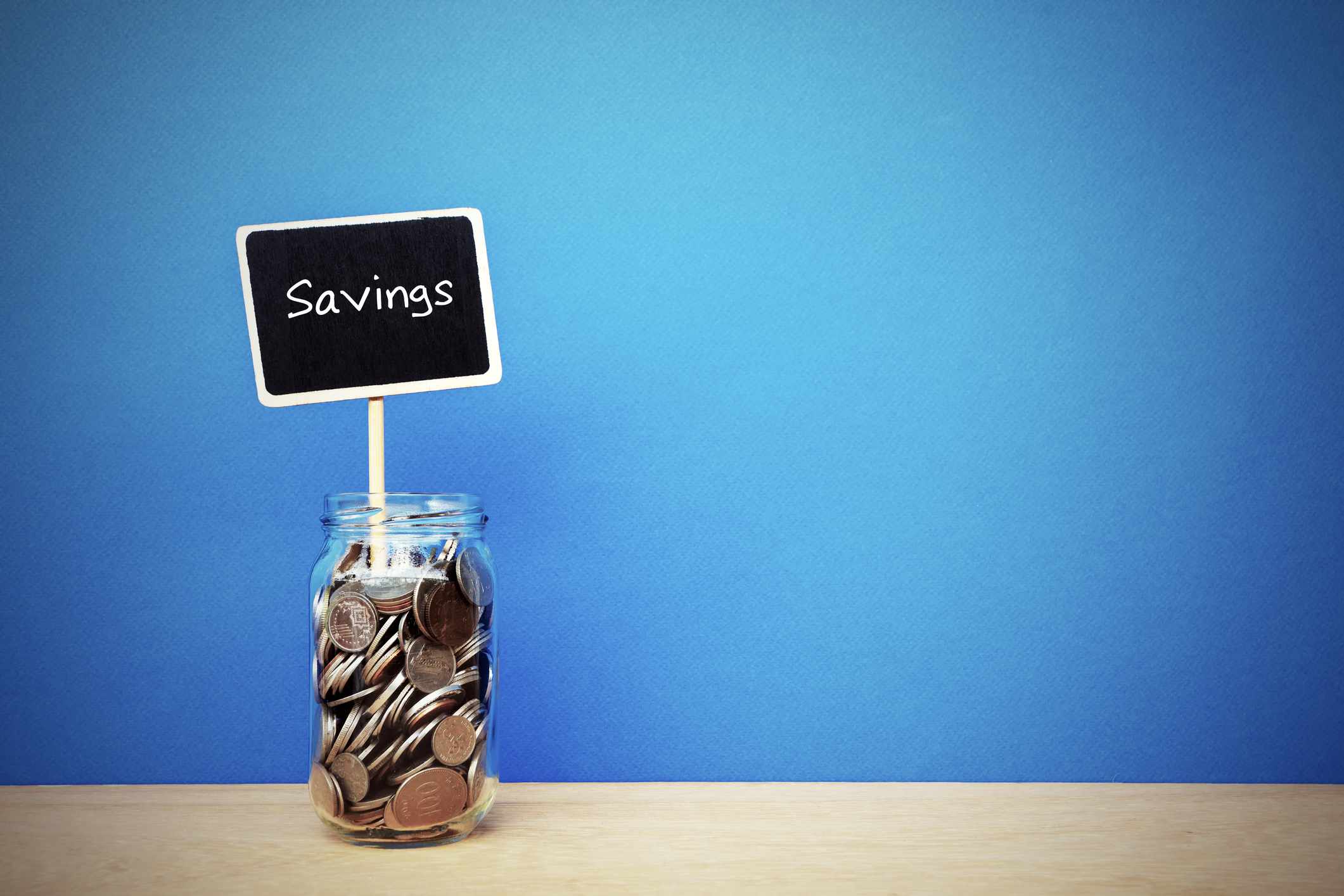 Savings jar with coins in it